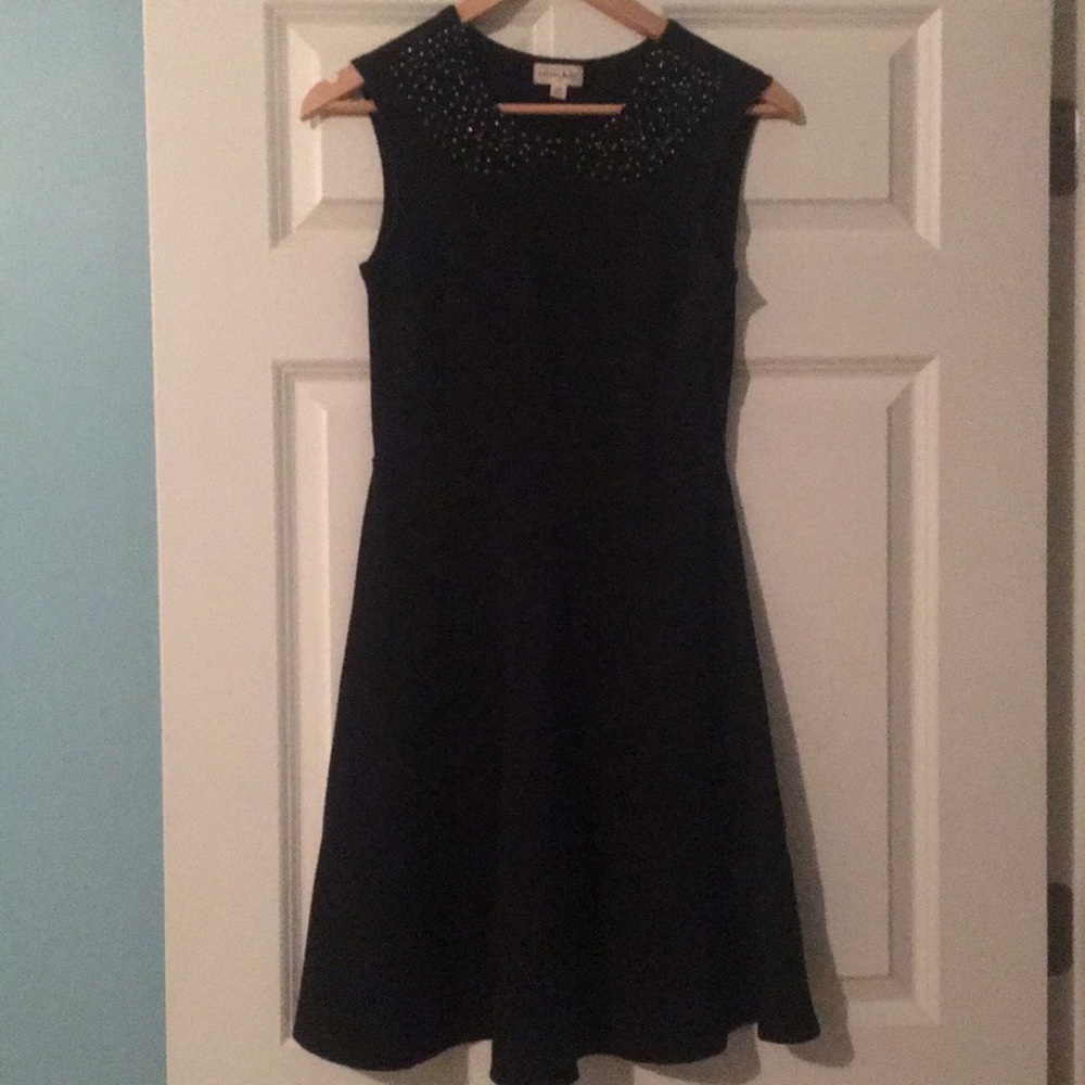 Black dress with beaded collar.